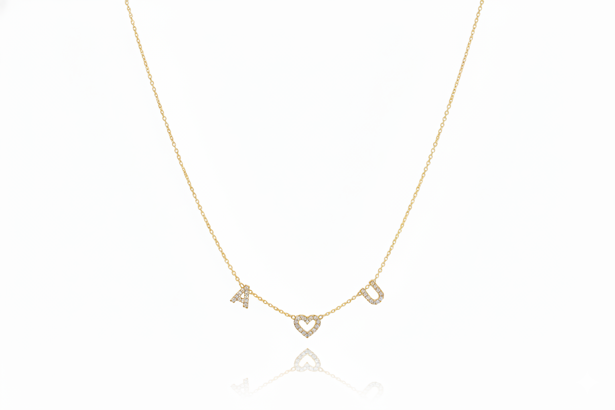 Gold necklace with letter 'A' pendant on a white background