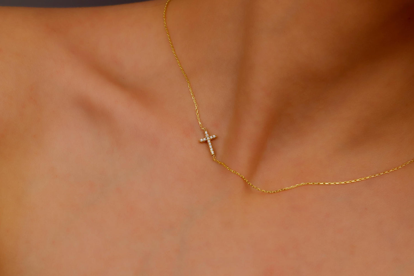 14K Gold Sideways Cross Necklace with Sparkling CZ Diamonds