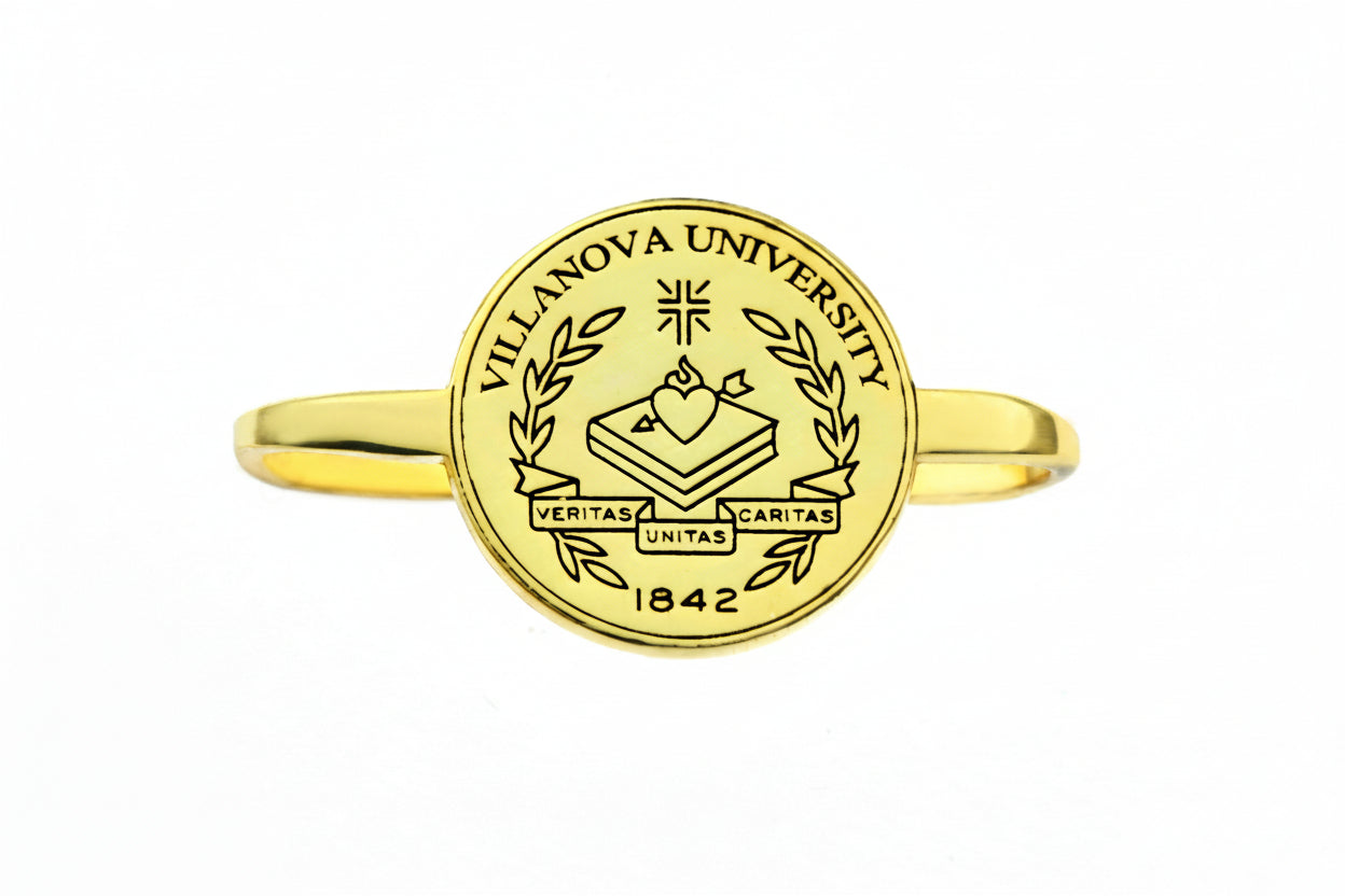 Gold ring with Villanova University emblem on a white background