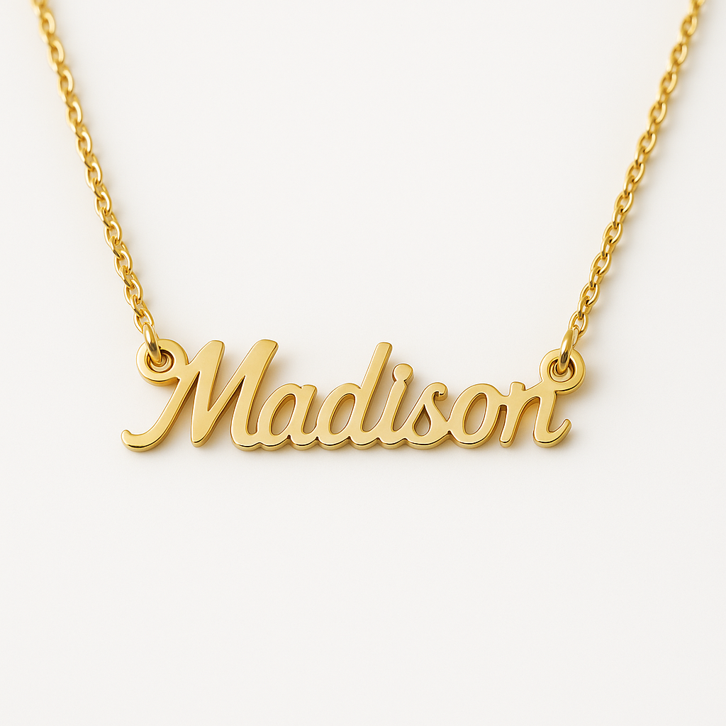 Gold necklace with 'Madison' pendant on a white background