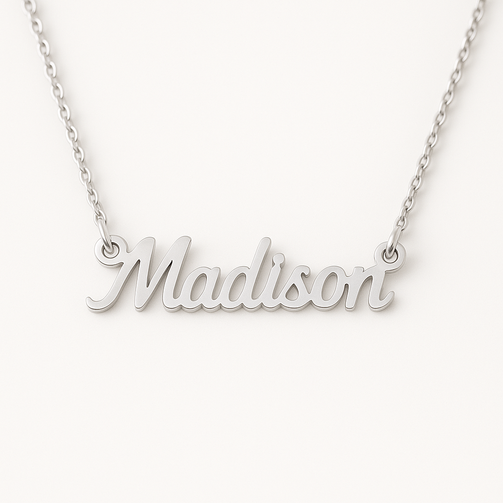 Silver necklace with 'Madison' pendant on a white background