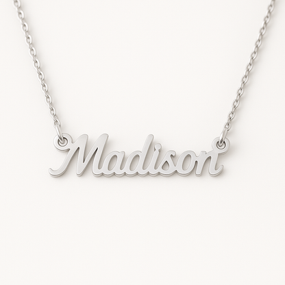 Silver necklace with 'Madison' pendant on a white background