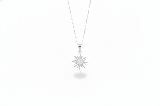 Sun-shaped pendant necklace on a white background