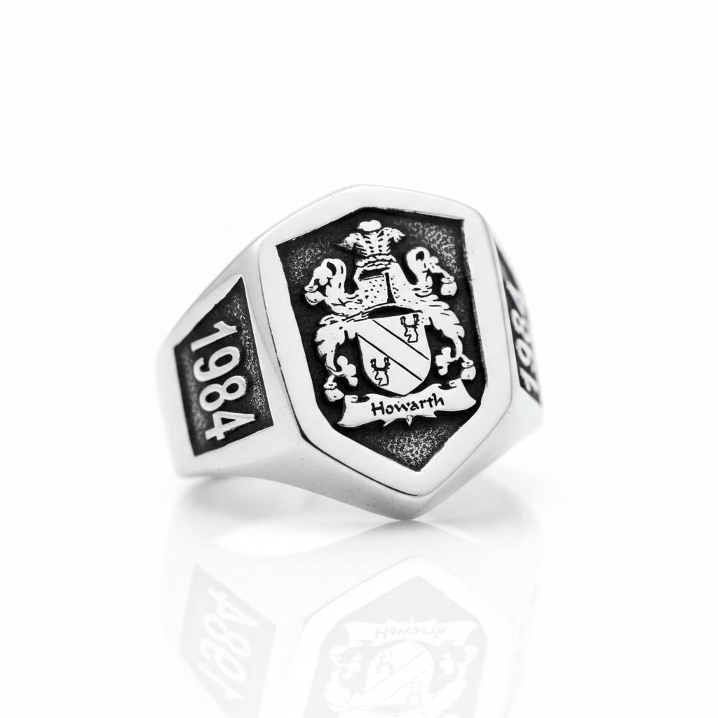 Silver ring with emblem and '1984' on a white background