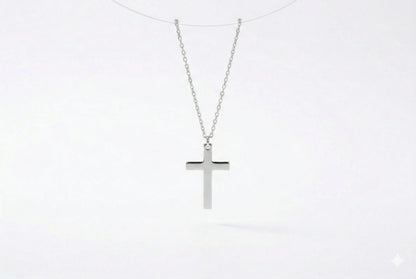 Silver cross necklace on a white background