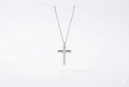 Silver cross necklace on a white background