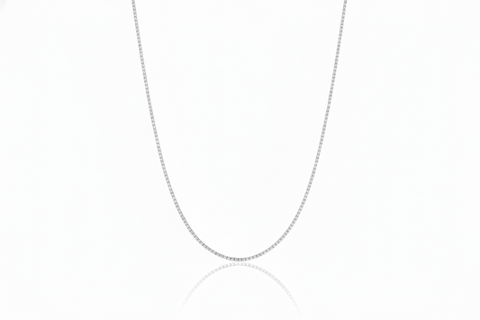 Silver chain necklace on a white background