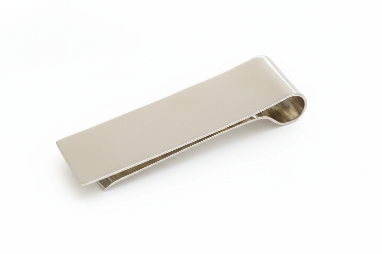 Silver money clip on a white background