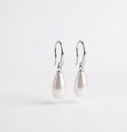 Pair of pearl earrings on a white background