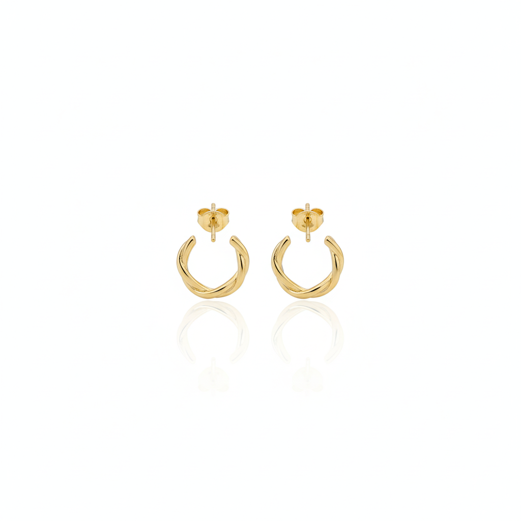 Gold hoop earrings on a white background