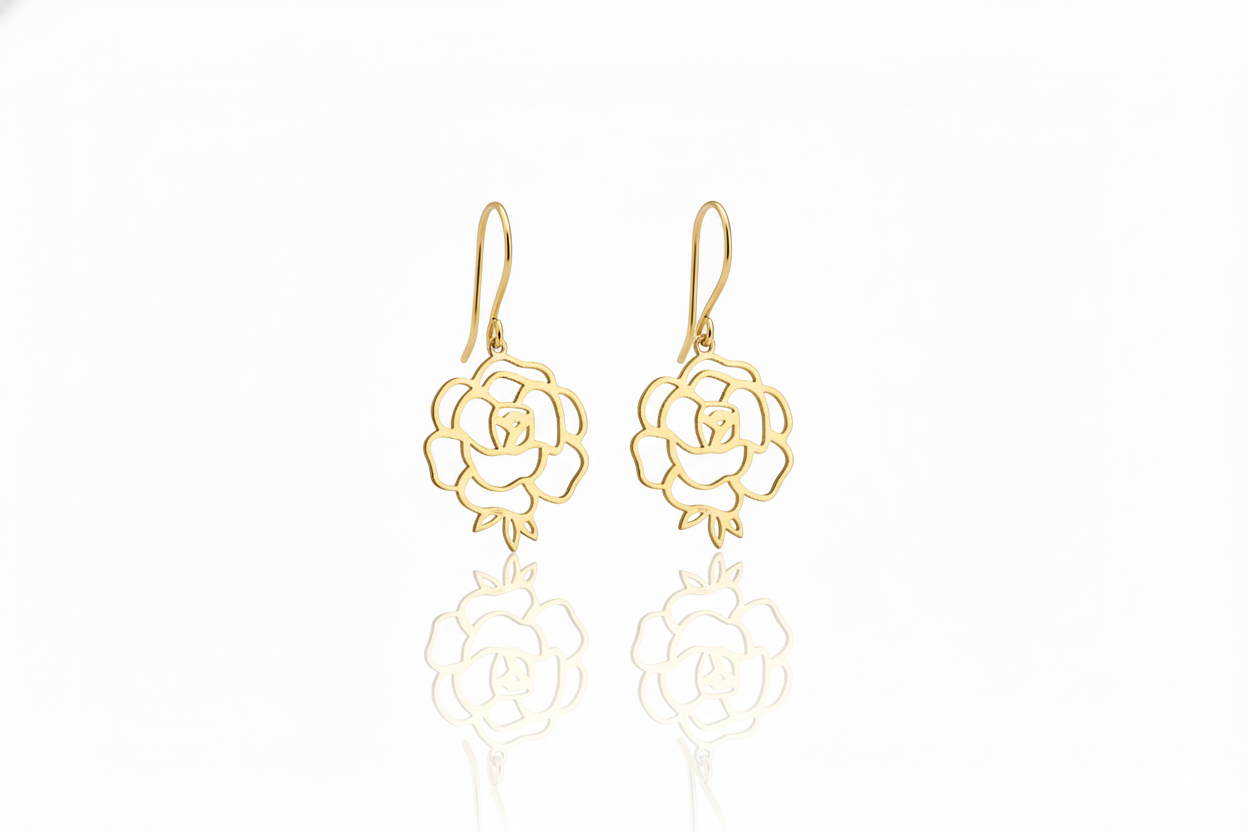 Gold rose-shaped earrings on a white background