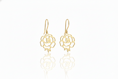 Gold rose-shaped earrings on a white background