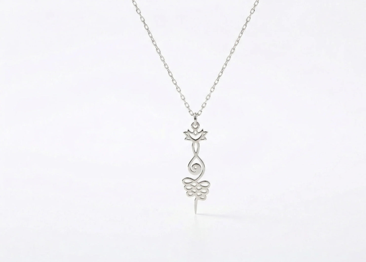 Silver necklace with a delicate pendant on a white background