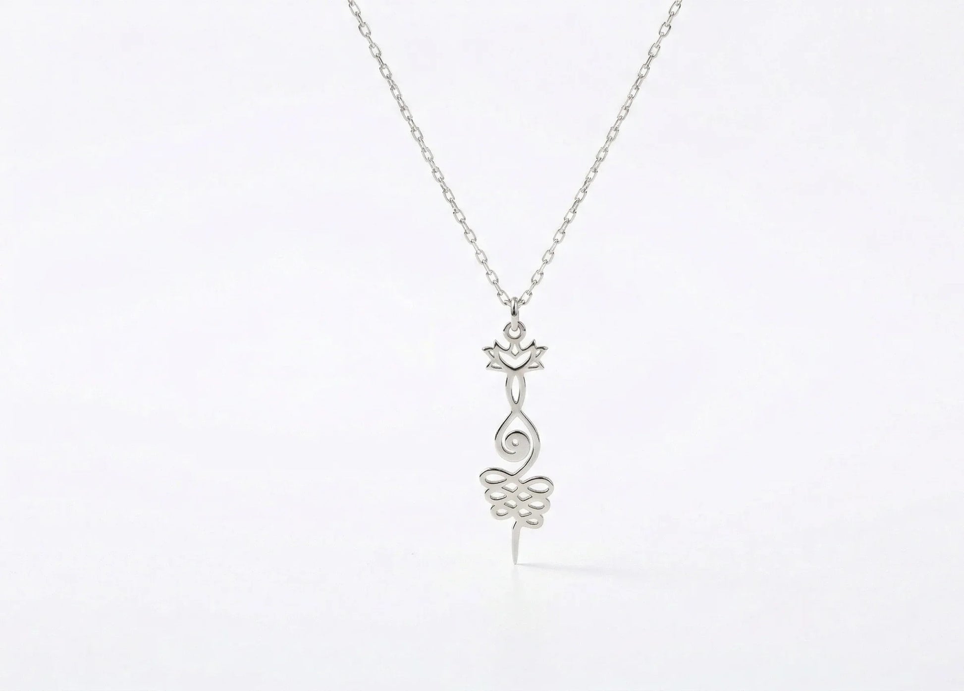 Silver necklace with a delicate pendant on a white background
