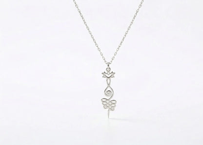 Silver necklace with a delicate pendant on a white background