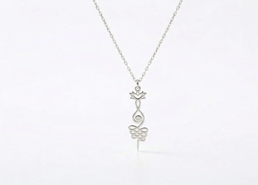 Silver necklace with a delicate pendant on a white background