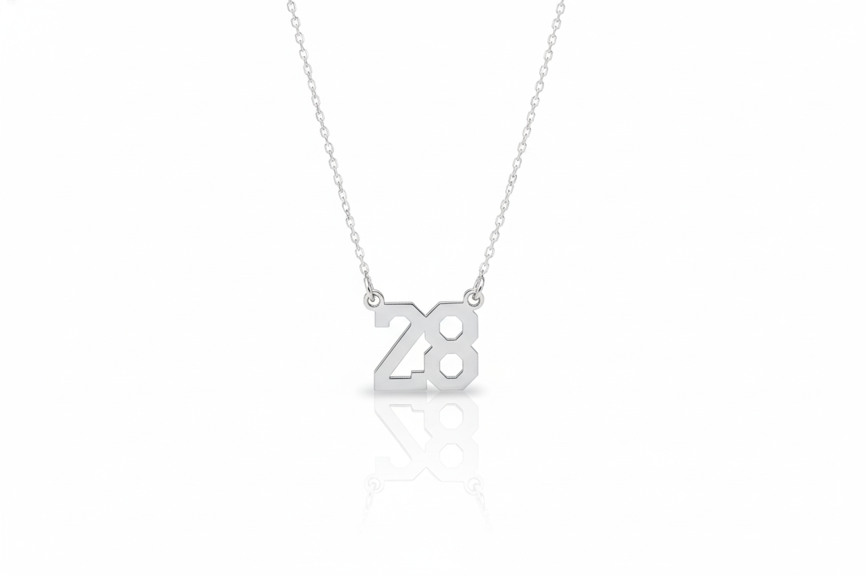 Silver necklace with '28' pendant on a white background