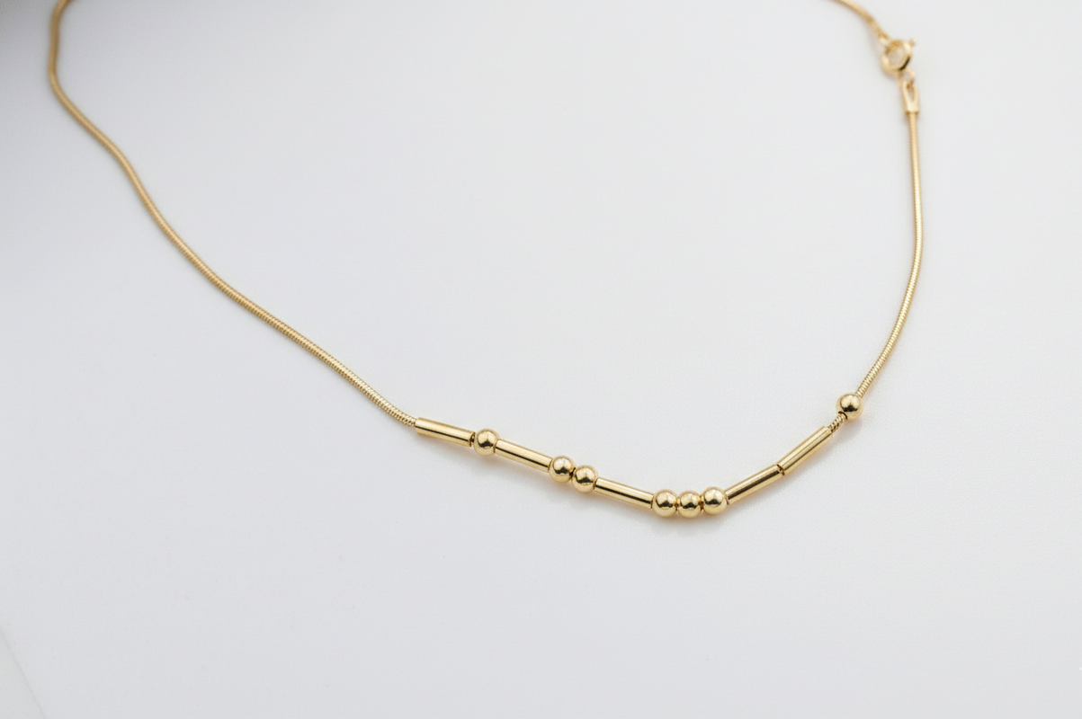 Gold necklace on a white background