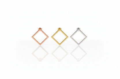 Three square-shaped earrings in rose gold, yellow gold, and silver on a white background