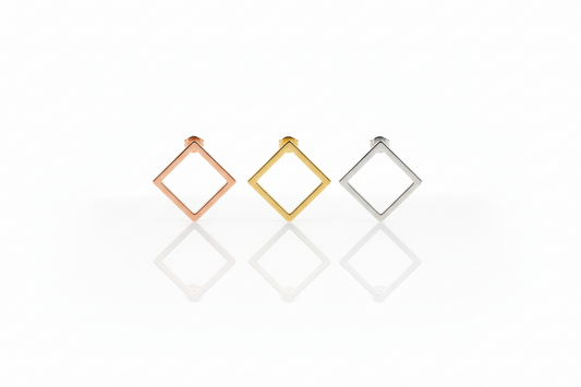 Three square-shaped earrings in rose gold, yellow gold, and silver on a white background