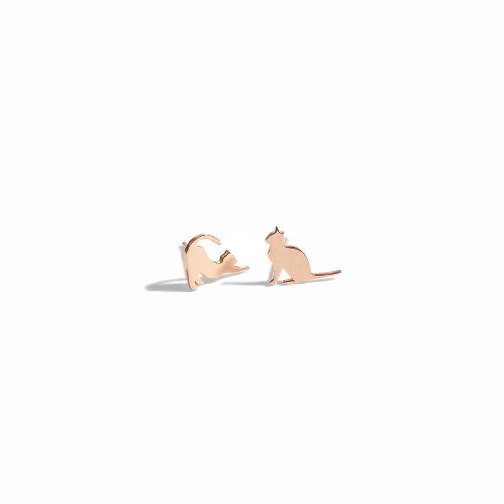 Rose gold cat-shaped earrings on a white background