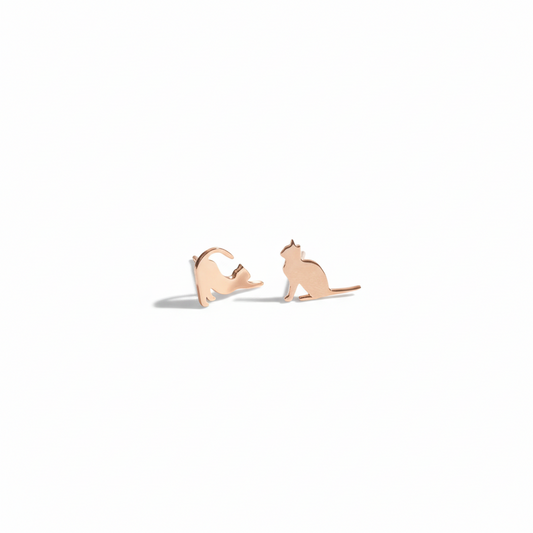 Rose gold cat-shaped earrings on a white background