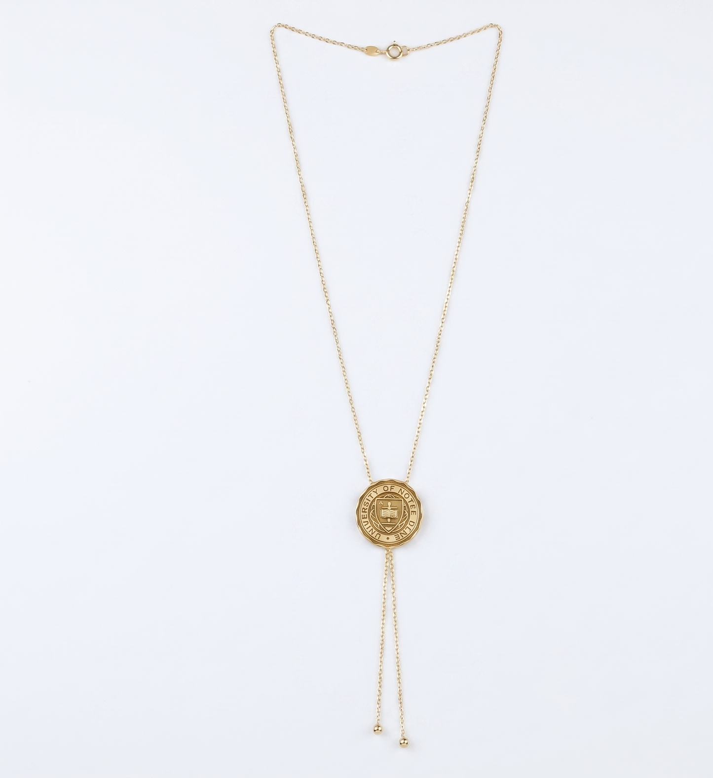 University logo necklace with a round pendant on a white background