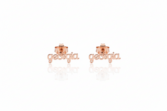 Rose gold 'georgia' earrings on a white background