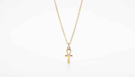Gold necklace with an ankh pendant on a white background
