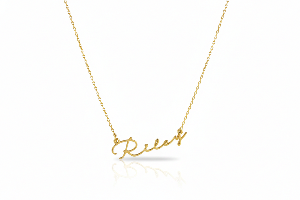 Gold necklace with 'Relax' pendant on a white background