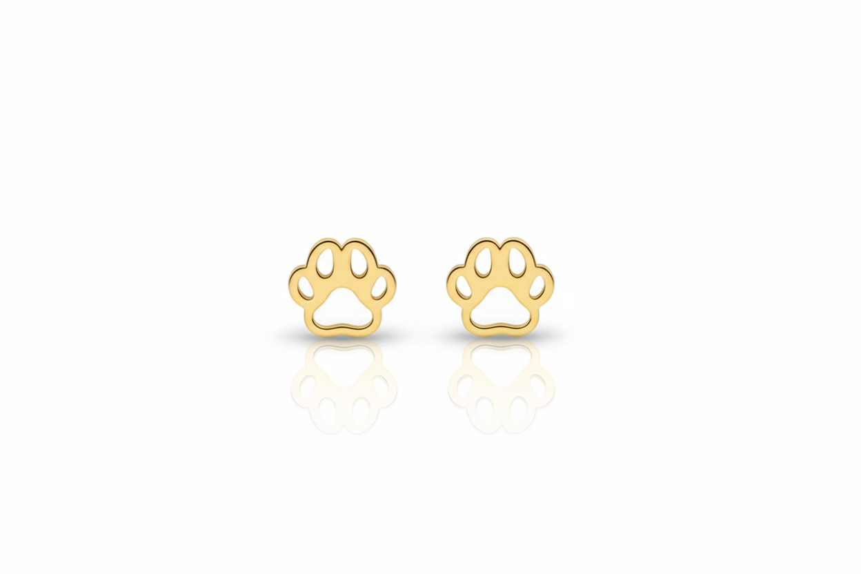 Gold paw print earrings on a white background