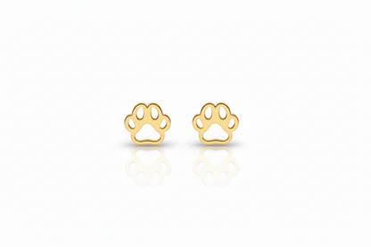 Gold paw print earrings on a white background