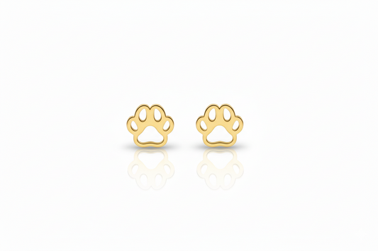 Gold paw print earrings on a white background