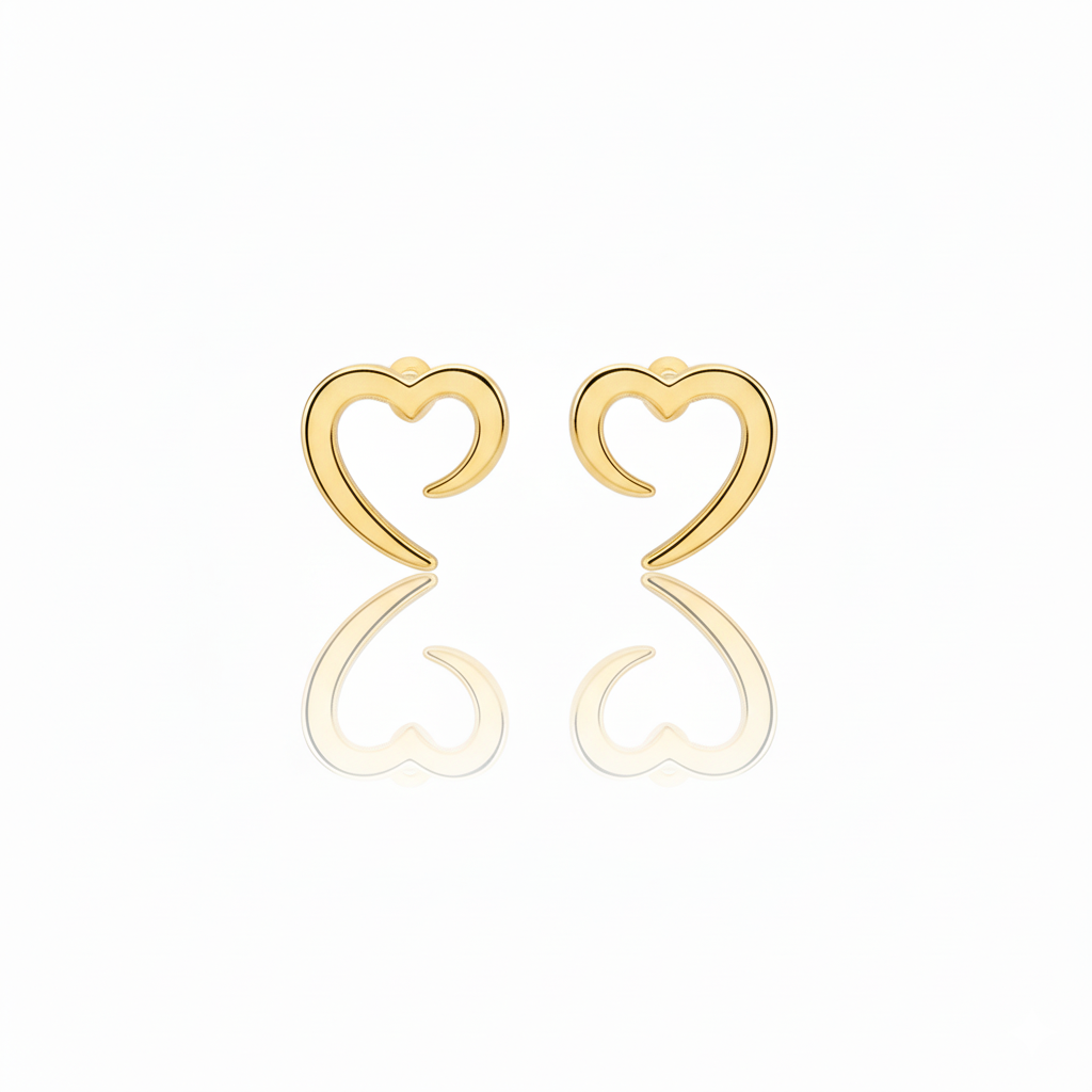 Gold heart-shaped earrings on a white background