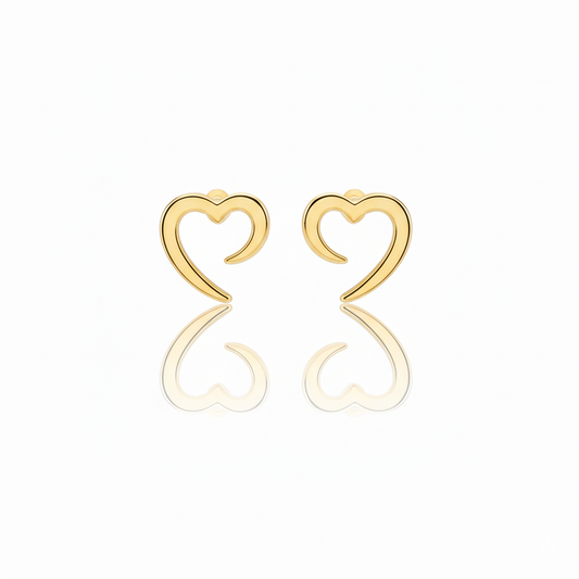 Gold heart-shaped earrings on a white background