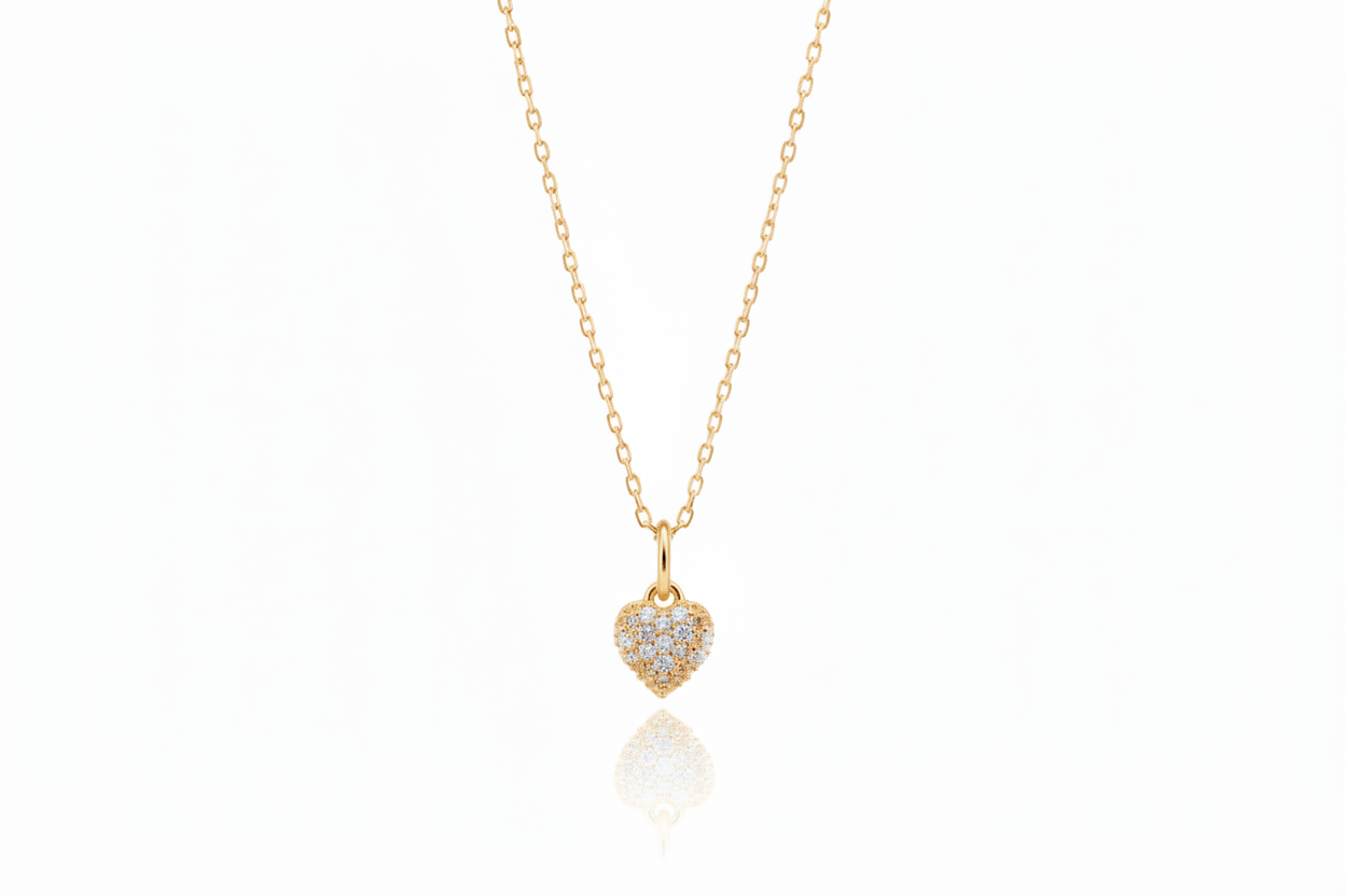 Gold heart-shaped pendant necklace on a white background