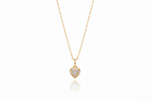 Gold heart-shaped pendant necklace on a white background