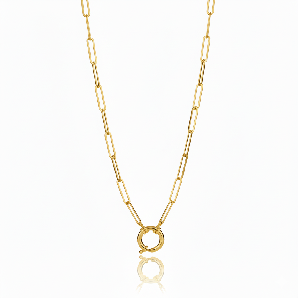 Gold chain necklace with a round clasp on a white background