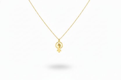 Gold necklace with a circular pendant on a white background