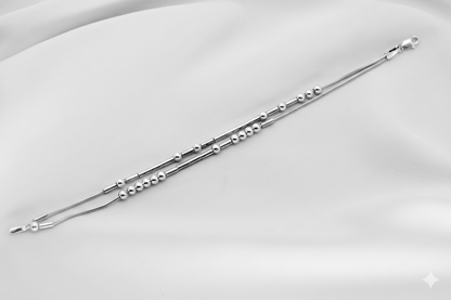 Silver bracelet with beads on a white background