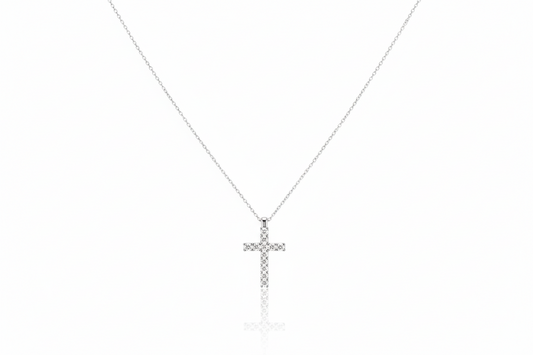 Silver cross necklace on a white background