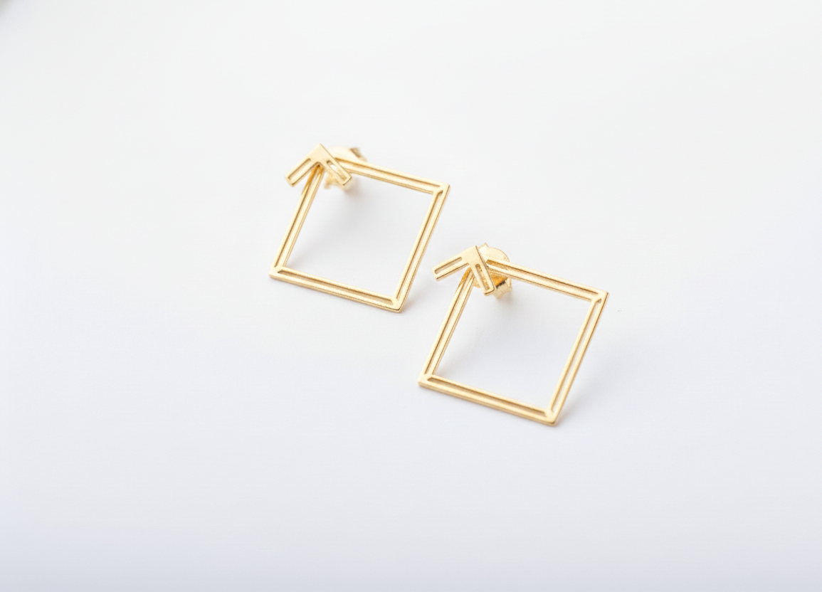 Gold square hoop earrings on a white background