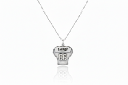 Silver necklace with a pendant on a white background