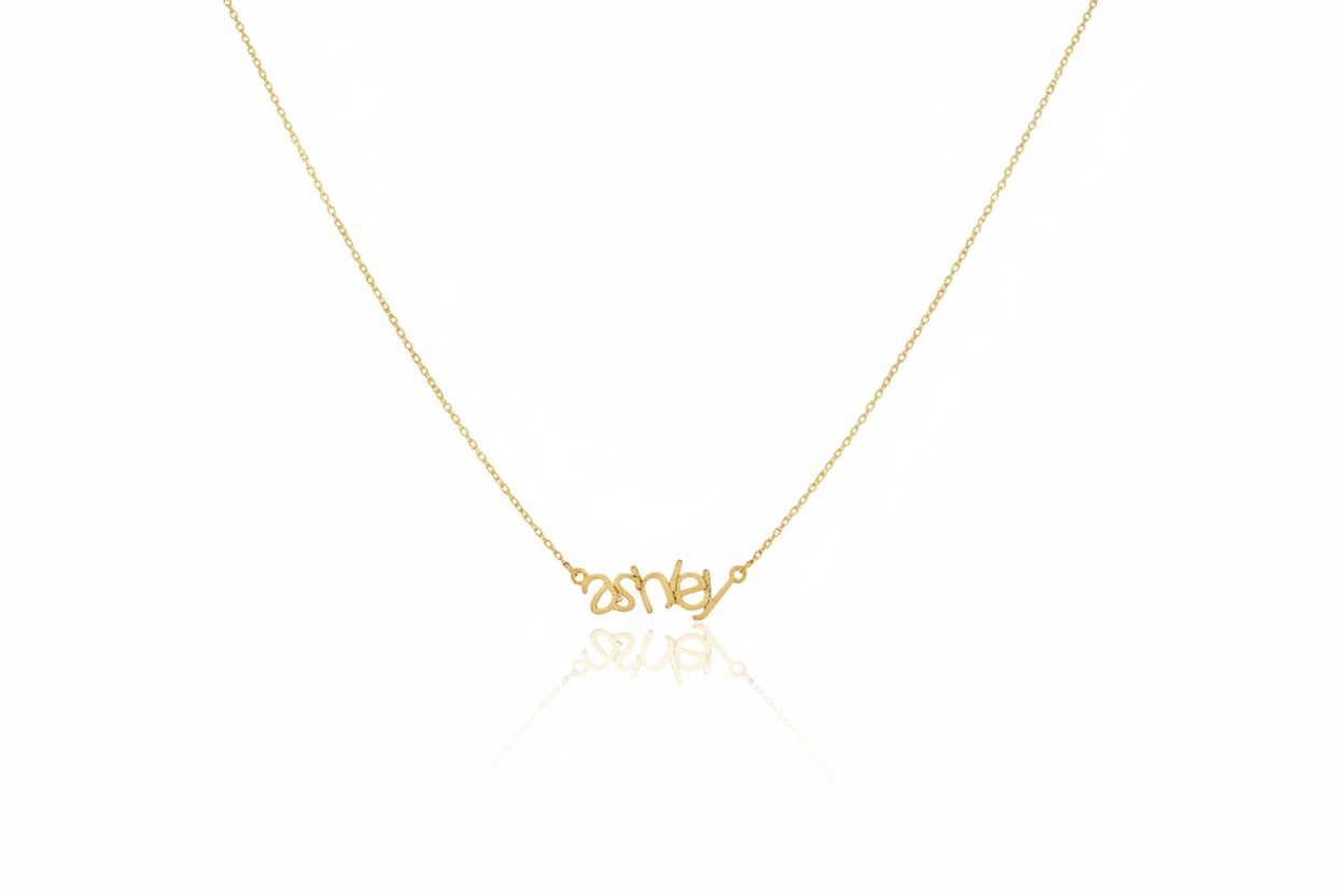 Gold necklace with 'Disney' pendant on a white background
