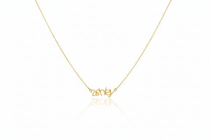 Gold necklace with 'Disney' pendant on a white background