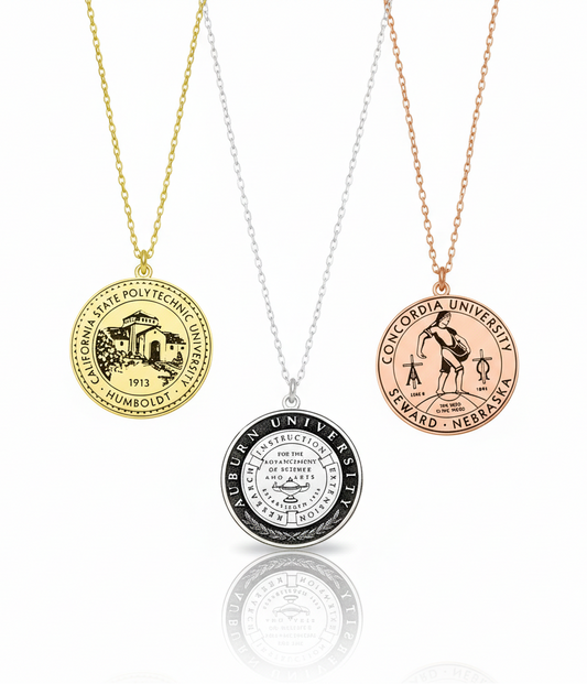 Three necklaces with different university emblems on a white background