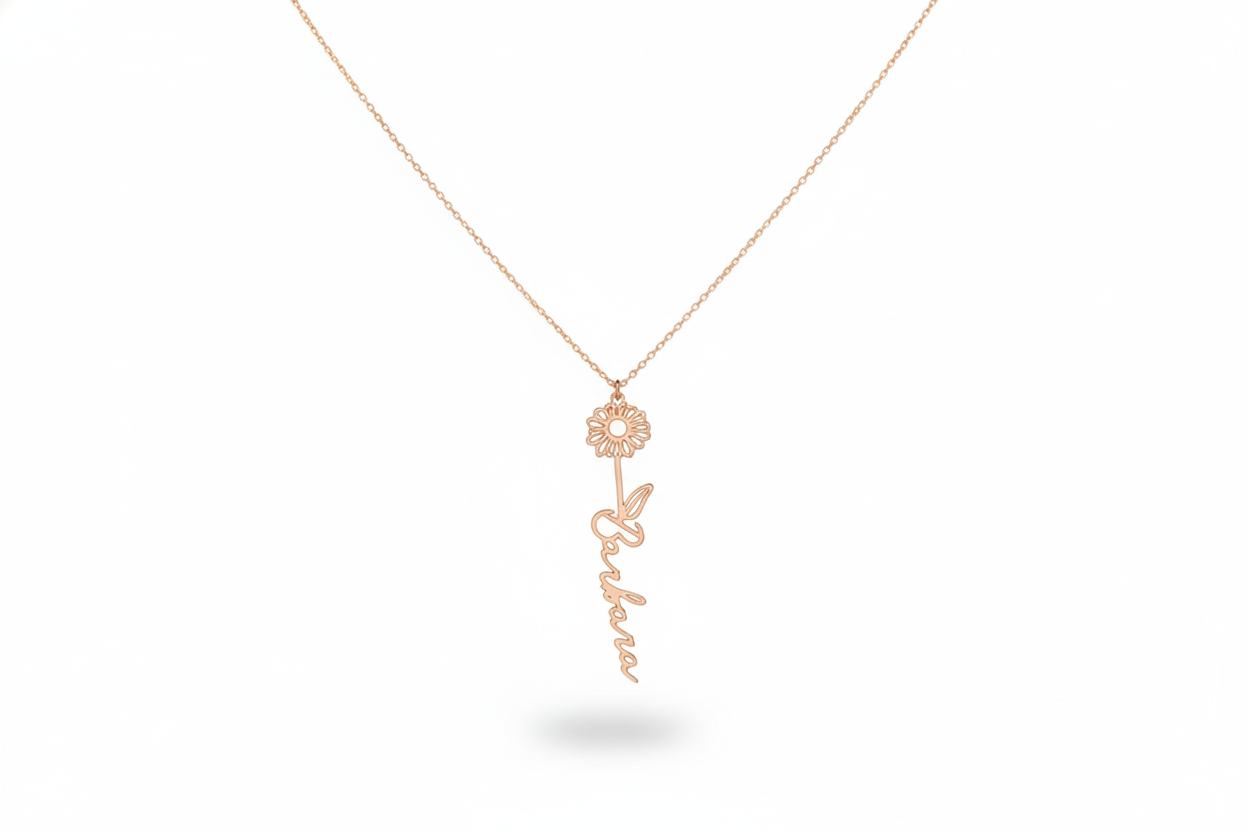Rose gold necklace with a floral pendant on a white background