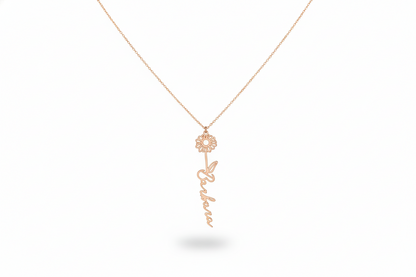 Rose gold necklace with a floral pendant on a white background