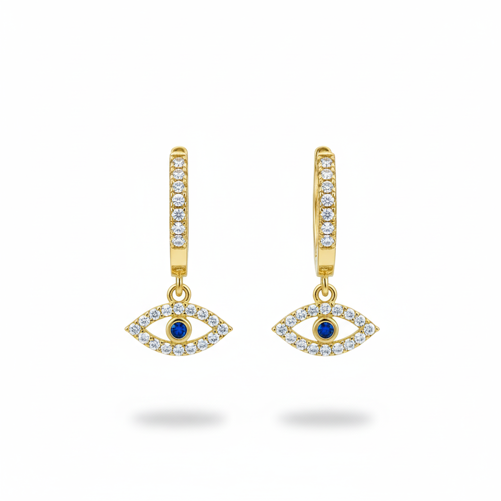 Gold earrings with eye design and blue gemstones on a white background