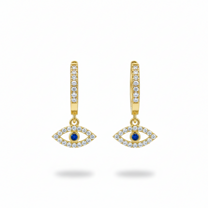 Gold earrings with eye design and blue gemstones on a white background